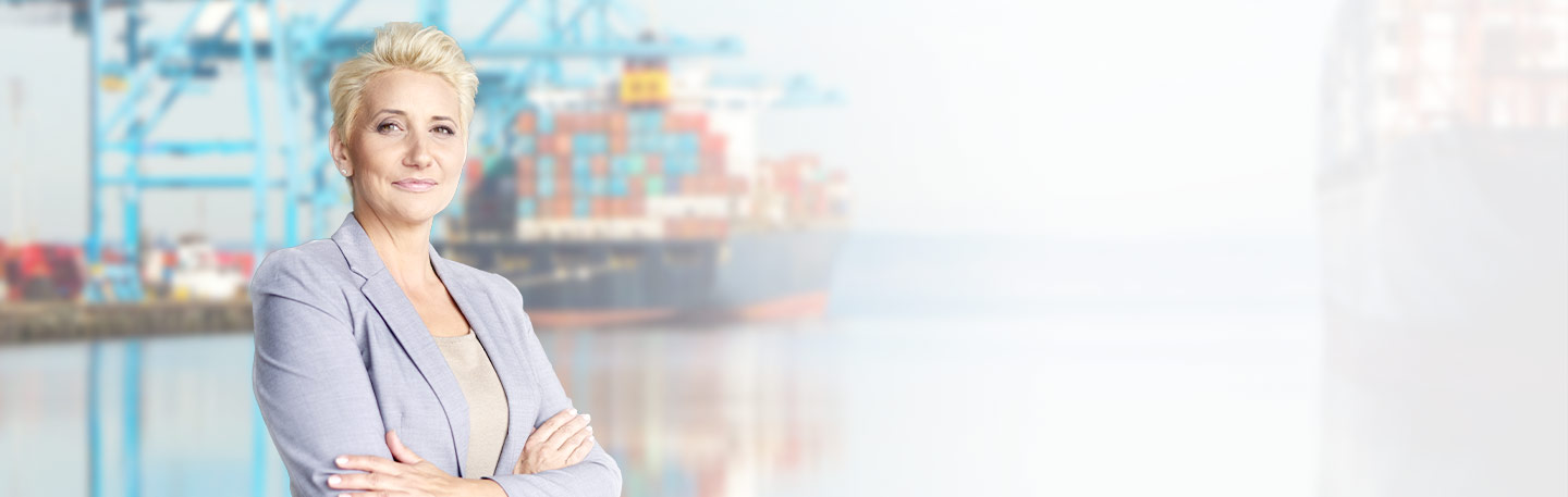 Business professional by shipyard docks.